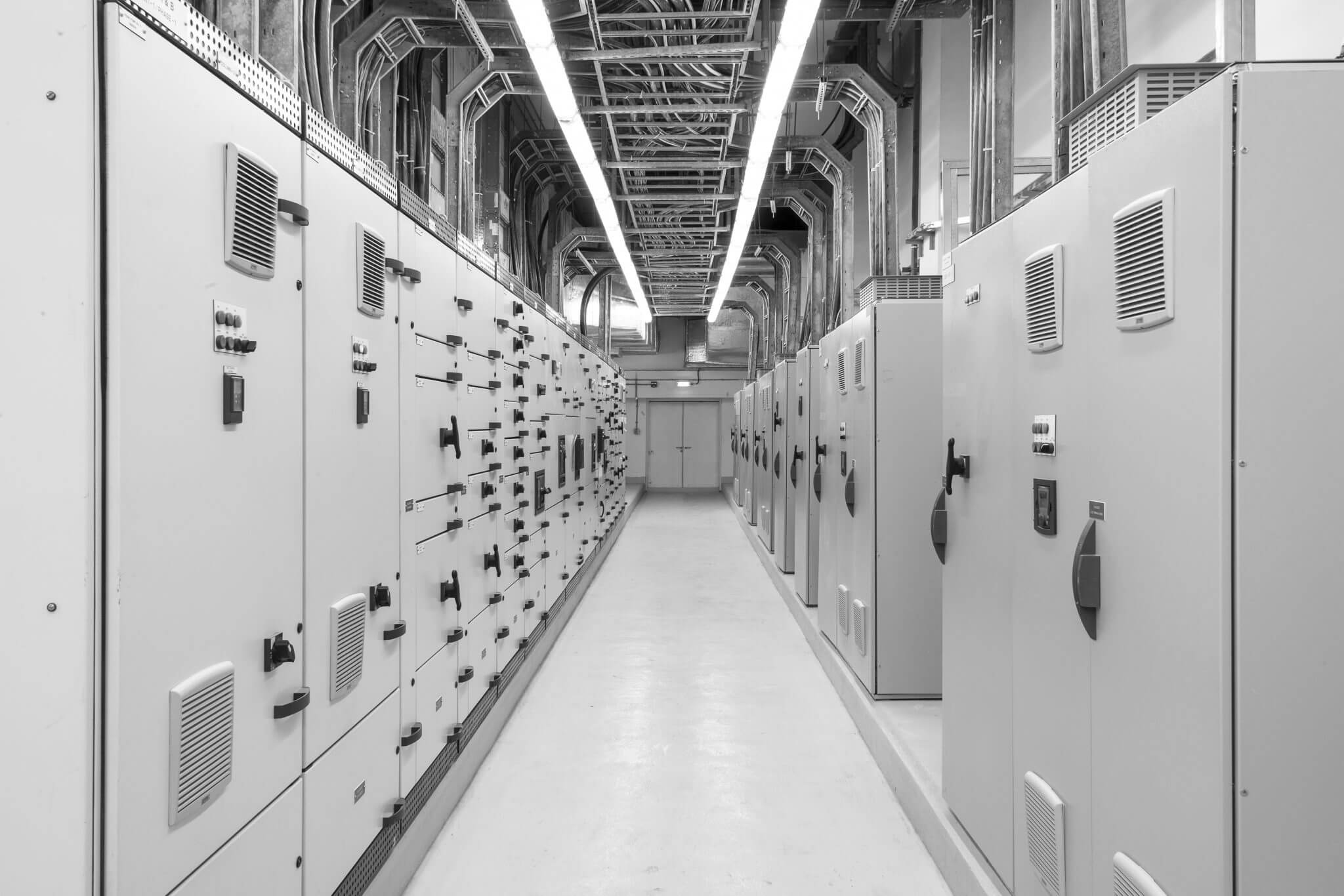 hallway filled with electrical equipment engineered by Automation + Controls Engineering, LLC